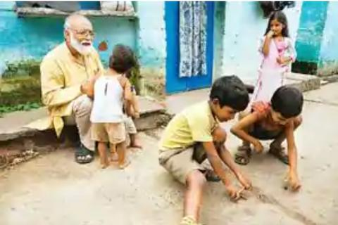 Anil Sadgopal the founding member and architect of Kishore Bharati engaging with children
